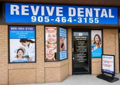 Exterior storefront of Revive Dental Mississauga showing the Revive Dental Clinic entrance, signage, and family dentistry service displays.