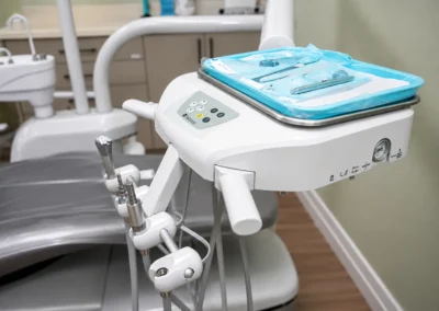 Revive Dental Clinic Machine at Revive Dental Mississauga showing a dental delivery unit with handpiece connections and packaged instruments beside a treatment chair.