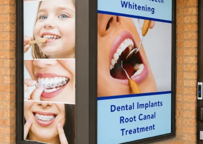 Revive Dental Clinic Outside Board at Revive Dental Mississauga displaying wisdom teeth extraction, teeth whitening, dental implants, root canal treatment, Invisalign, and braces services.