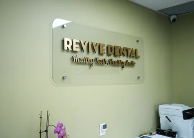 Revive Dental Clinic Entrance Board at Revive Dental Mississauga displaying the “Revive Dental – Healthy Teeth, Healthy Smile” sign inside the clinic.
