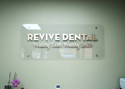 Revive Dental Clinic Board inside Revive Dental Mississauga displaying the “Revive Dental – Healthy Teeth, Healthy Smile” clinic sign.